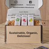 Cardboard box with Bona furtuna products on a wooden surface - 3-month extra virgin olive oil subscription