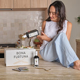 Women pouring olive oil in kitchen - 6-month prepaid olive oil monthly subscription