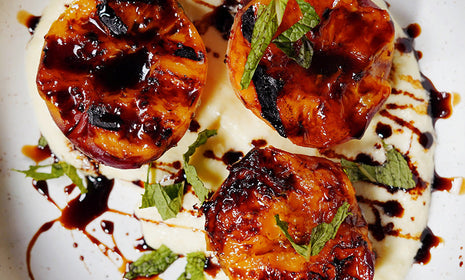 Grilled Peaches with Honey-Whipped Ricotta, Pistachios, & Aged Balsamic Vinegar