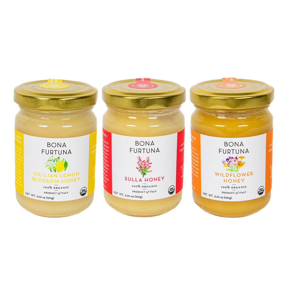 Three glass jars of Bona Furtuna organic honey arranged side by side on a white background. The jars have gold lids and labels for Sicilian Lemon Blossom Honey, Sulla Honey, and Wildflower Honey.
