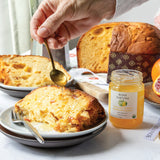 Bona Furtuna Lemon Blossom Honey spooned onto Panettone - organic raw honey